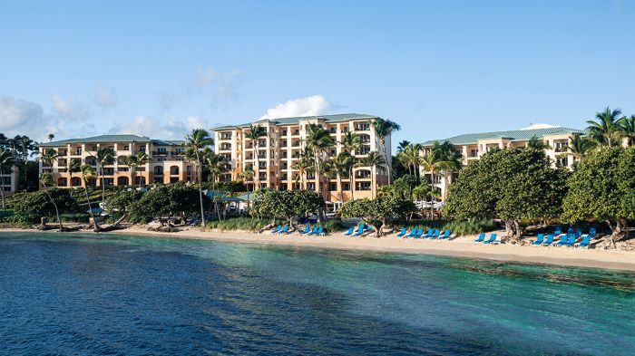 Beach front resort with blue beach chairs